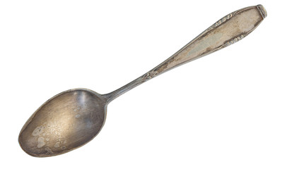 Top view of old silver beautiful tea spoon isolated on white background