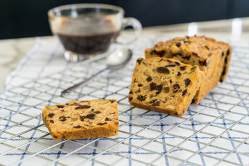 delicious sliced fruit cake with mixed fruit  on grate and fubric
