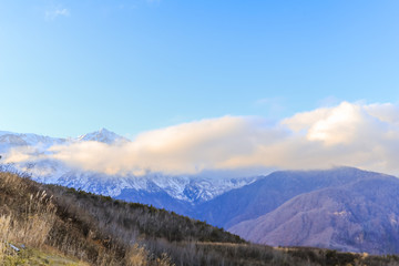 Fototapeta na wymiar Beautiful landscape view of Hakuba in the winter with snow on the mountain and blue sky background in Nagano Prefecture Japan.