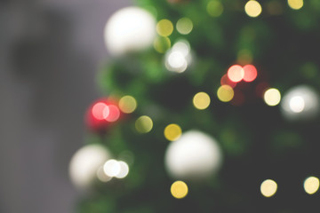 Obraz premium Christmas tree and holiday decorations. Blurred defocused background