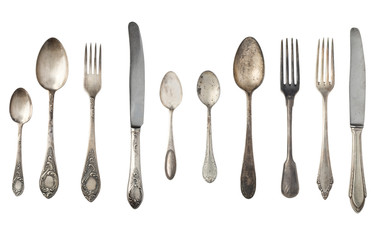 Vintage spoons, forks and knives isolated on a white background. Retro silverware.