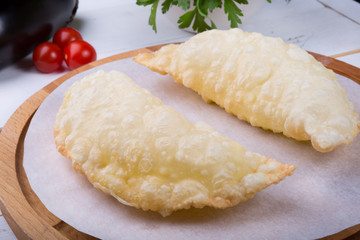 Traditional uzbek fried cheburek dough