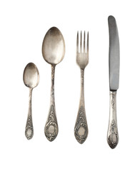 Vintage spoons, forks and knives isolated on a white background. Retro silverware.