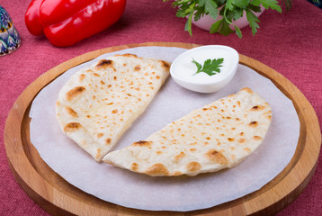 Traditional uzbek fried cheburek dough