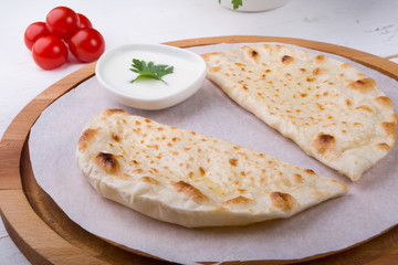 Traditional uzbek fried cheburek dough