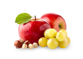 Red apples with grape bunch and hazelnuts isolated on white background