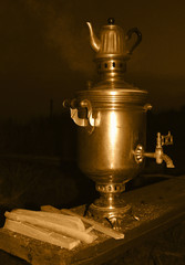 Copper vintage samovar with hot tea.