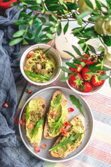 breakfast on the table, fresh snacks and berries, the table is decorated with flowers and candles, copy space