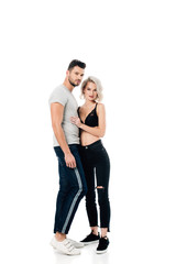 beautiful heterosexual couple hugging and looking at camera isolated on white
