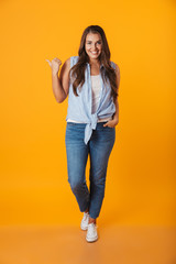 Full length portrait of a smiling young overweight woman