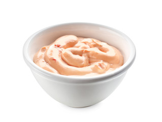 Tasty sauce in bowl on white background