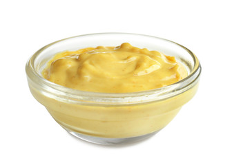 Tasty yellow sauce in bowl on white background