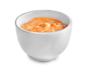 Tasty sauce in bowl on white background