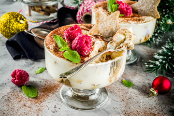 Christmas dessert idea, Gingerbread Tiramisu Trifle Parfaits woth fresh raspberry and mint leaves. copy space