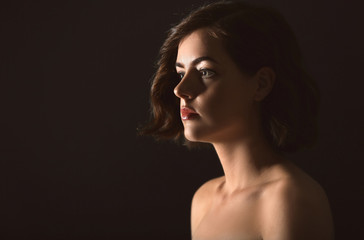 Fototapeta premium Portrait of beautiful young woman on dark background