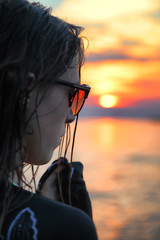 Close Up Profile Portrait Of Girl Looking At The Sun, Twilight Blur Background 