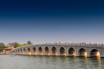 Fototapeta na wymiar Seventeen Arches Bridge and South Lake Island of Summer Palace in Beijing, China.