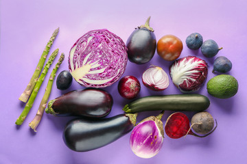 Various fresh vegetables with fruits on color background