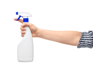 Woman holding bottle of detergent on white background