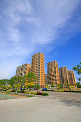 Fototapeta na wymiar High-rise building under the blue sky