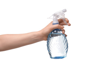 Woman holding spray bottle of water on white background