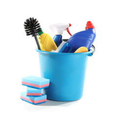 Bucket with cleaning supplies on white background