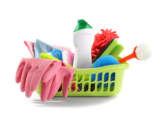 Basket with cleaning supplies on white background