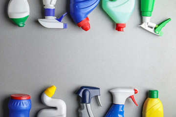 Bottles of detergents on grey background