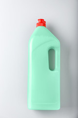 Bottle of detergent on light background