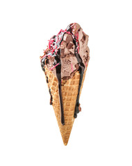 Waffle cone with delicious ice cream and chocolate sauce on white background