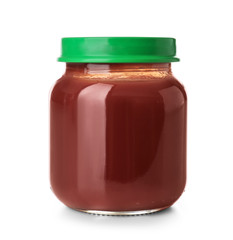 Glass jar with healthy baby food on white background