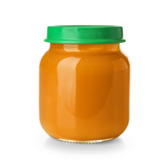 Glass jar with healthy baby food on white background