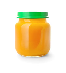 Glass jar with healthy baby food on white background