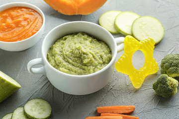 Casserole with healthy baby food on table