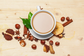 Coffee cup with saucer on a wooden background top view