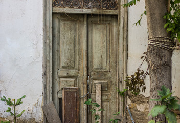 Fototapeta na wymiar slum poor wooden door in backstreet yard of ghetto dirty urban city district 