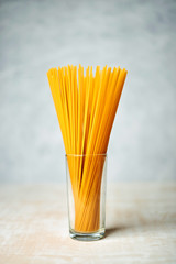 bunch of spaghetti on wooden background