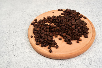 black sesame seeds on wooden spoon