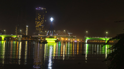 Han river bridge in Danang is opening in the evening ligtining with different colors.Vietnam