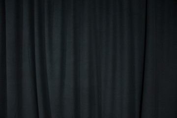 Black stage curtain with spotlight