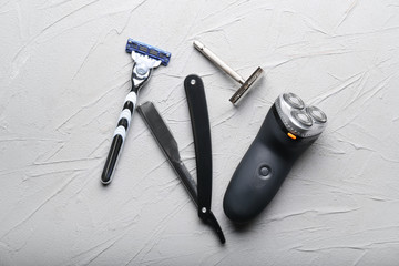 Shaving accessories on grey textured background, flat lay