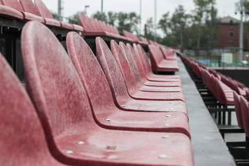Football stadium bleachers red chairs