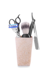 Shaving accessories on white background
