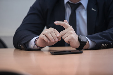 Businessman gesturing with hands during speech