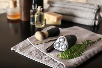 Shaving accessories for men on dark table