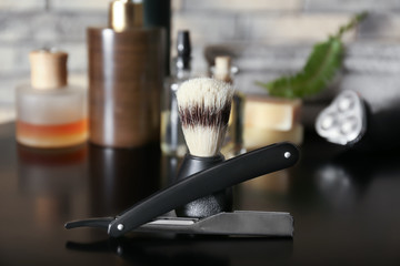 Shaving accessories for men on dark table