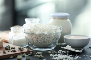 Different milk products on dark table