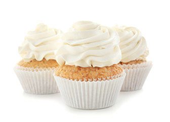Delicious cupcakes on white background