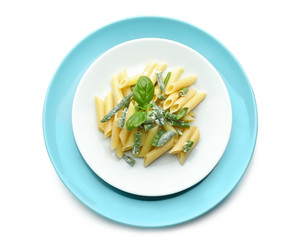 Plates with tasty penne pasta on white background