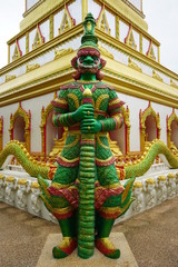 Fototapeta premium Giant status in front of pagoda